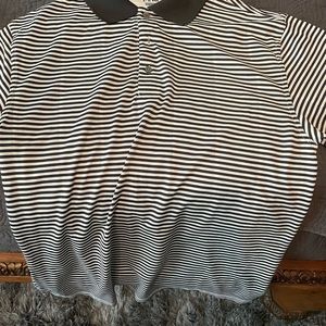 Black and whipping golf polo.